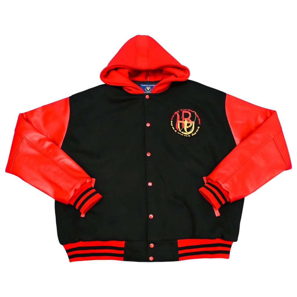 Black body hooded letterman jacket with vibrant red leather sleeves, red hood, embroidered circular chest logo, and black striped ribbed trim from our letterman jackets online collection.