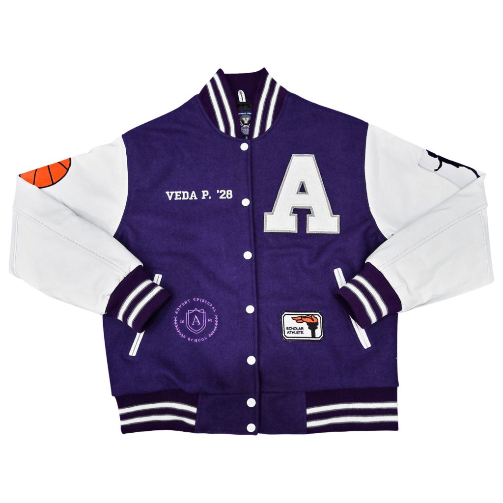 Purple wool body letterman jacket with white leather sleeves, large white letter "A" chest patch, custom "VEDA P. '28" embroidery, Advent Episcopal School crest, and Scholar Athlete patch from our letterman jackets online collection.