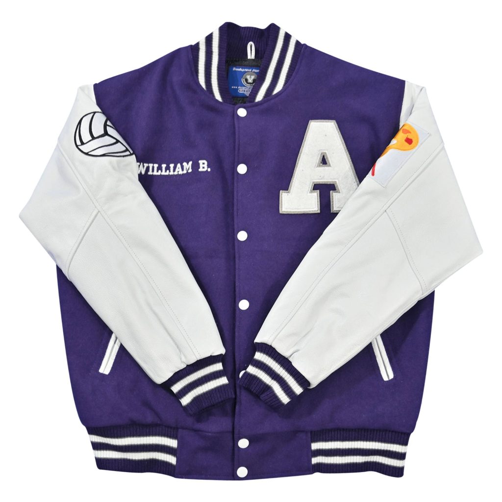 Purple wool body letterman jacket with white leather sleeves, large white letter "A" chest patch, custom "WILLIAM B." embroidery, volleyball patch, and white-striped purple ribbed trim from our letterman jackets online collection.
